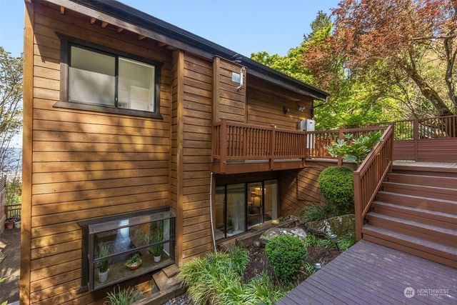 a front view of a house with plants