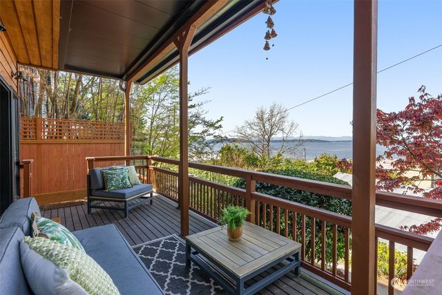 a view of a two chairs in the balcony