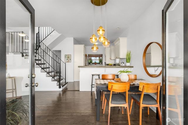 a dining room with furniture and entryway