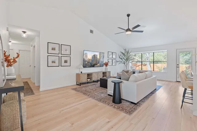 a living room with furniture and a large window