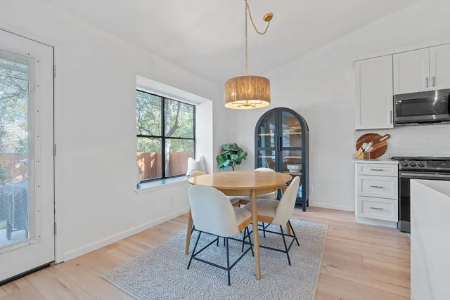 a kitchen with a stove microwave and refrigerator