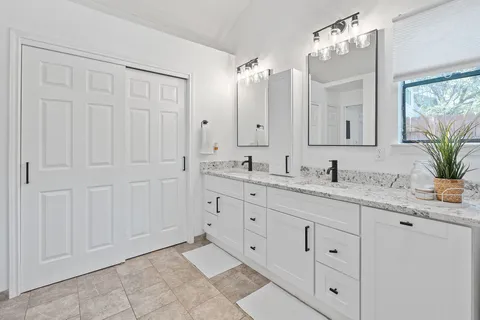 a bedroom with a bed and a closet