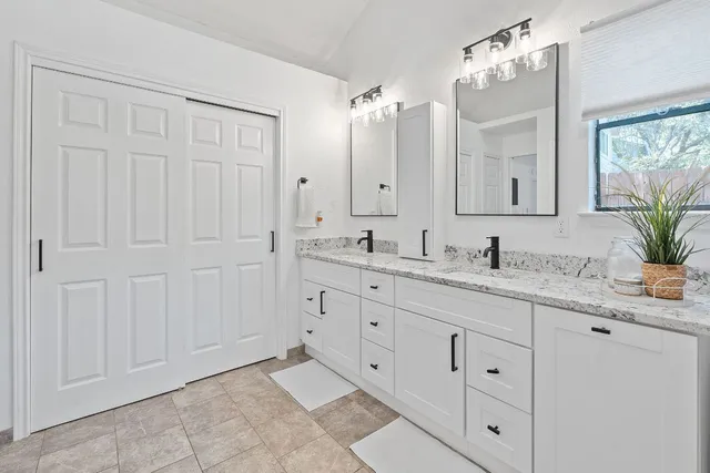 a bedroom with a bed and a closet