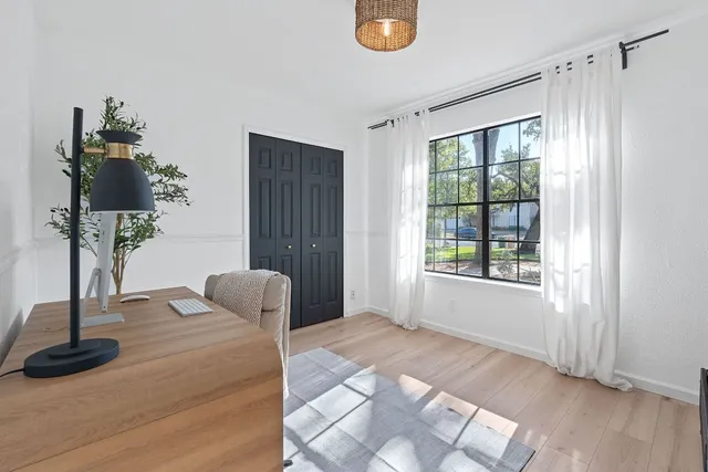 a spacious bathroom with a granite countertop sink mirror and a