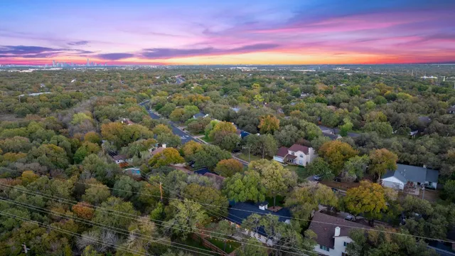 a front view of a house with a garden and patio