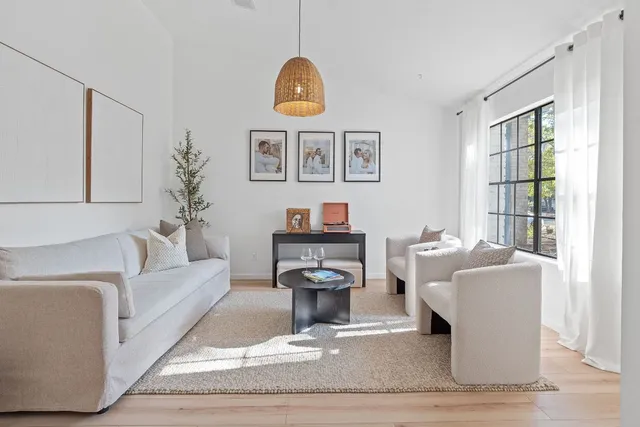 a view of a backyard with sitting area and garden