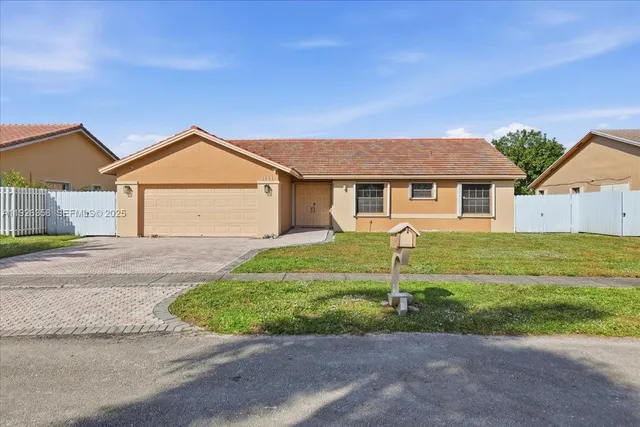 front view of a house and a yard