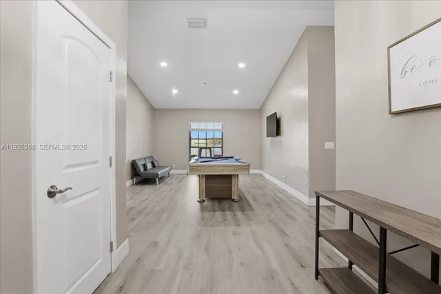 wooden floor in an empty room with a fireplace
