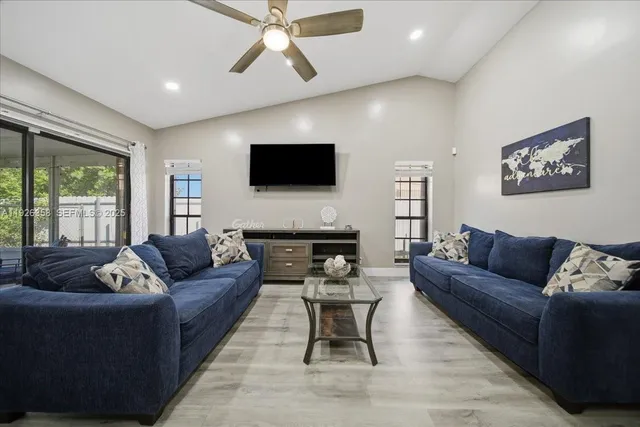 a living room with furniture and a flat screen tv