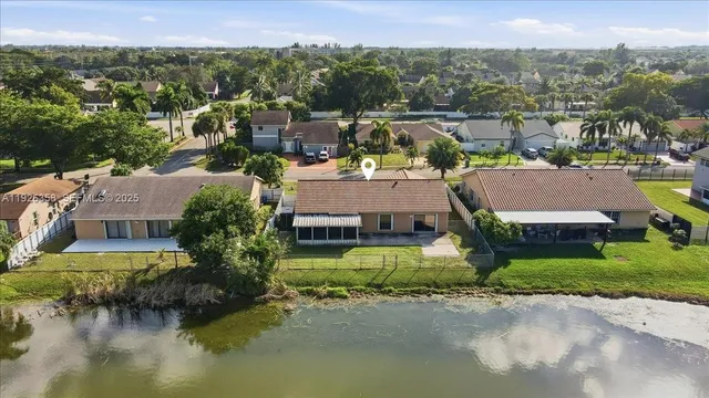 an aerial view of a house with a garden and plants