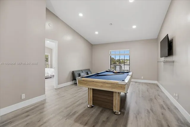 a room with furniture and wooden floor