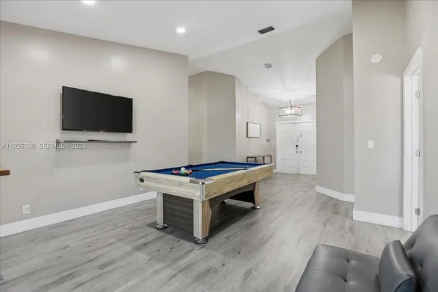 a room with furniture and a flat screen tv