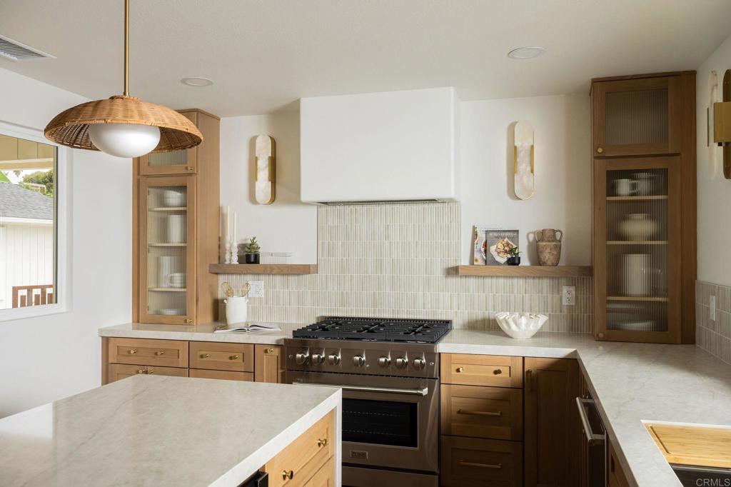 1551 Burgundy Road Encinitas, CA 92024 - Photo 13 of 45 a kitchen with a stove and a refrigerator