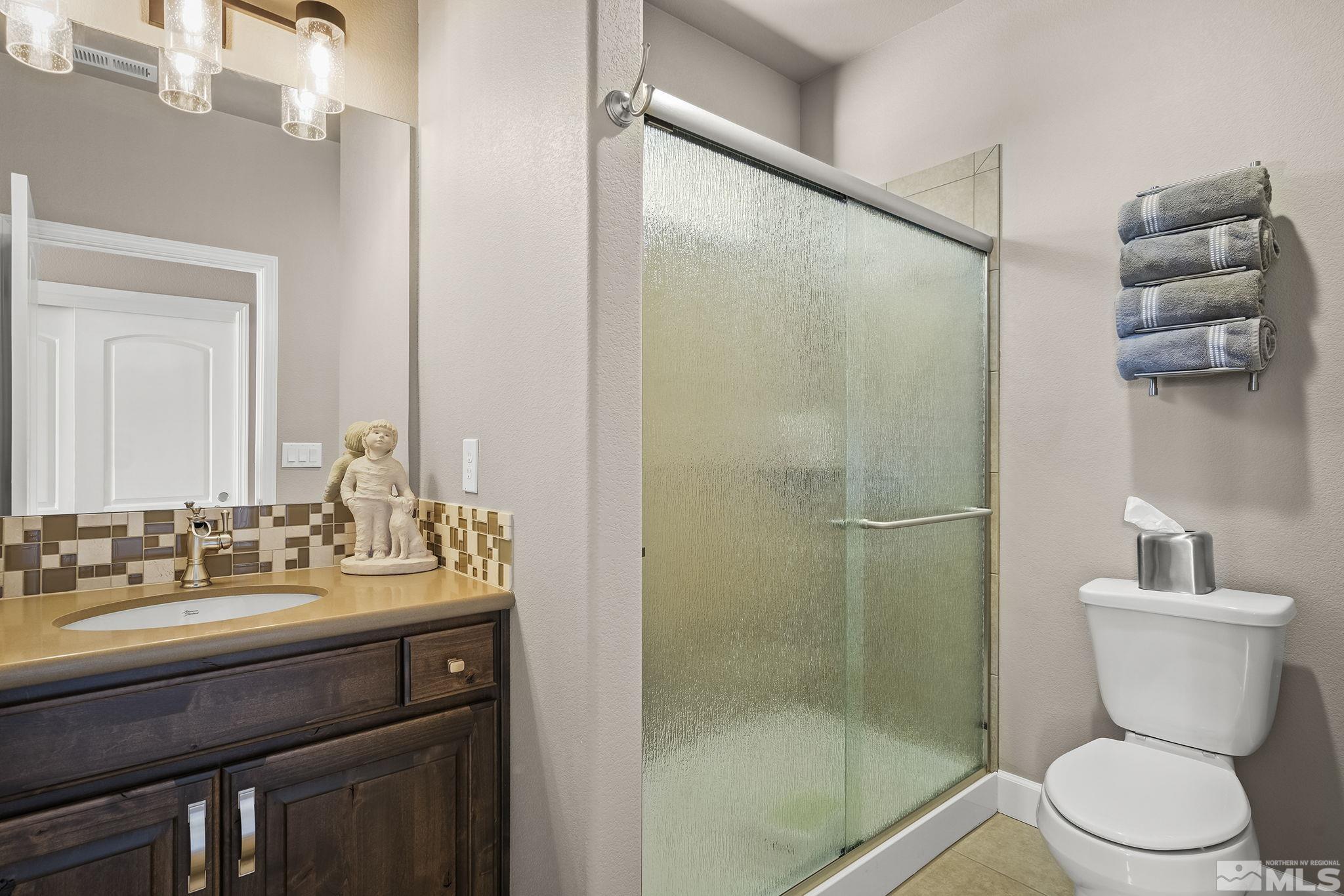 2173 Berkich Court Reno, NV 89521 - Photo 13 of 29 a bathroom with a sink toilet and shower