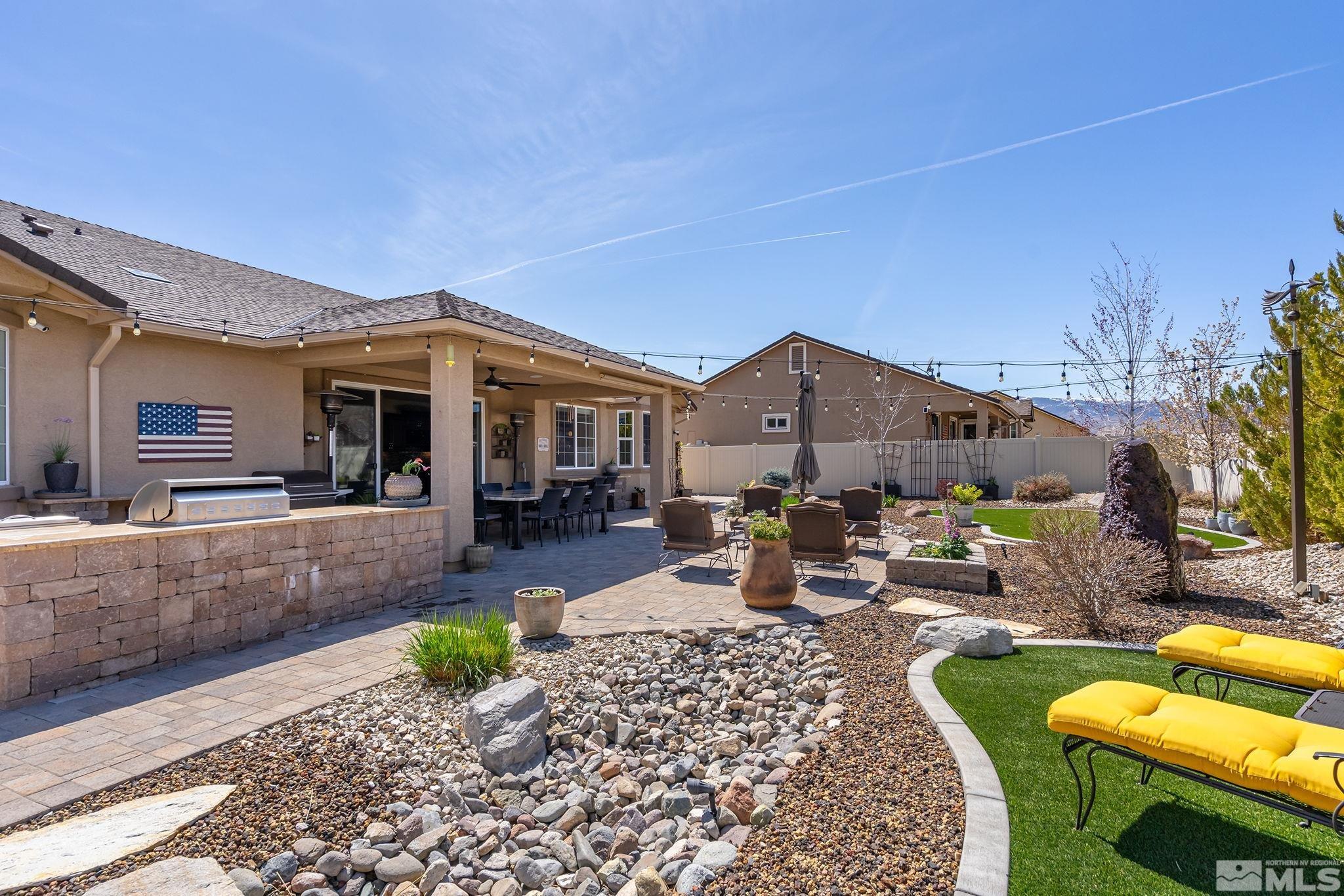 2173 Berkich Court Reno, NV 89521 - Photo 24 of 29 a view of a house with backyard porch and sitting area