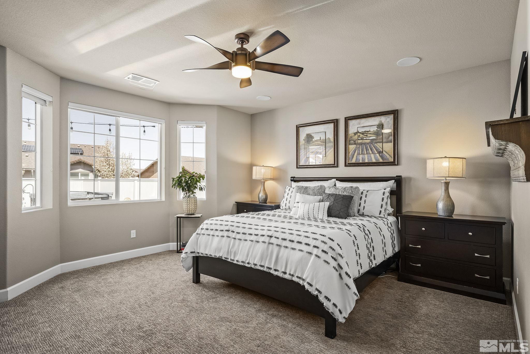 2173 Berkich Court Reno, NV 89521 - Photo 8 of 29 a bedroom with a bed and window