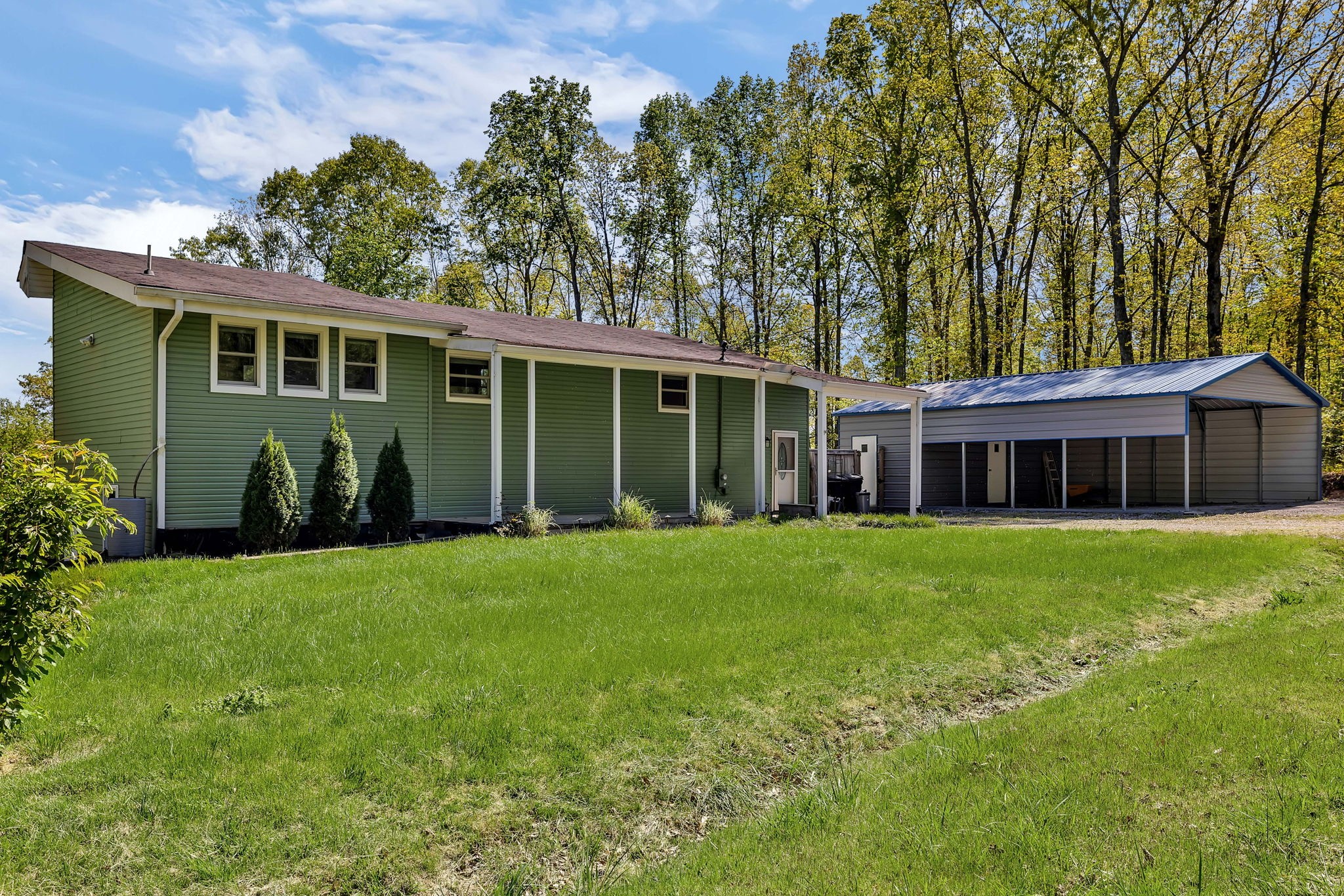 1104 Deer Ridge Road Kingston Springs, TN 37082 - Photo 1 of 36 a view of a house with a yard