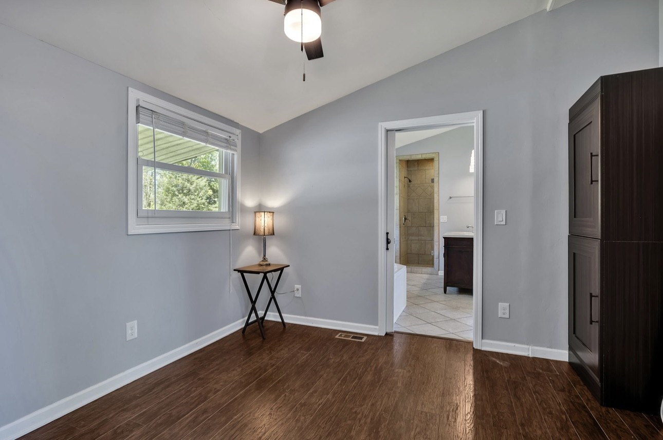 1104 Deer Ridge Road Kingston Springs, TN 37082 - Photo 14 of 36 a view of empty room with wooden floor and fan