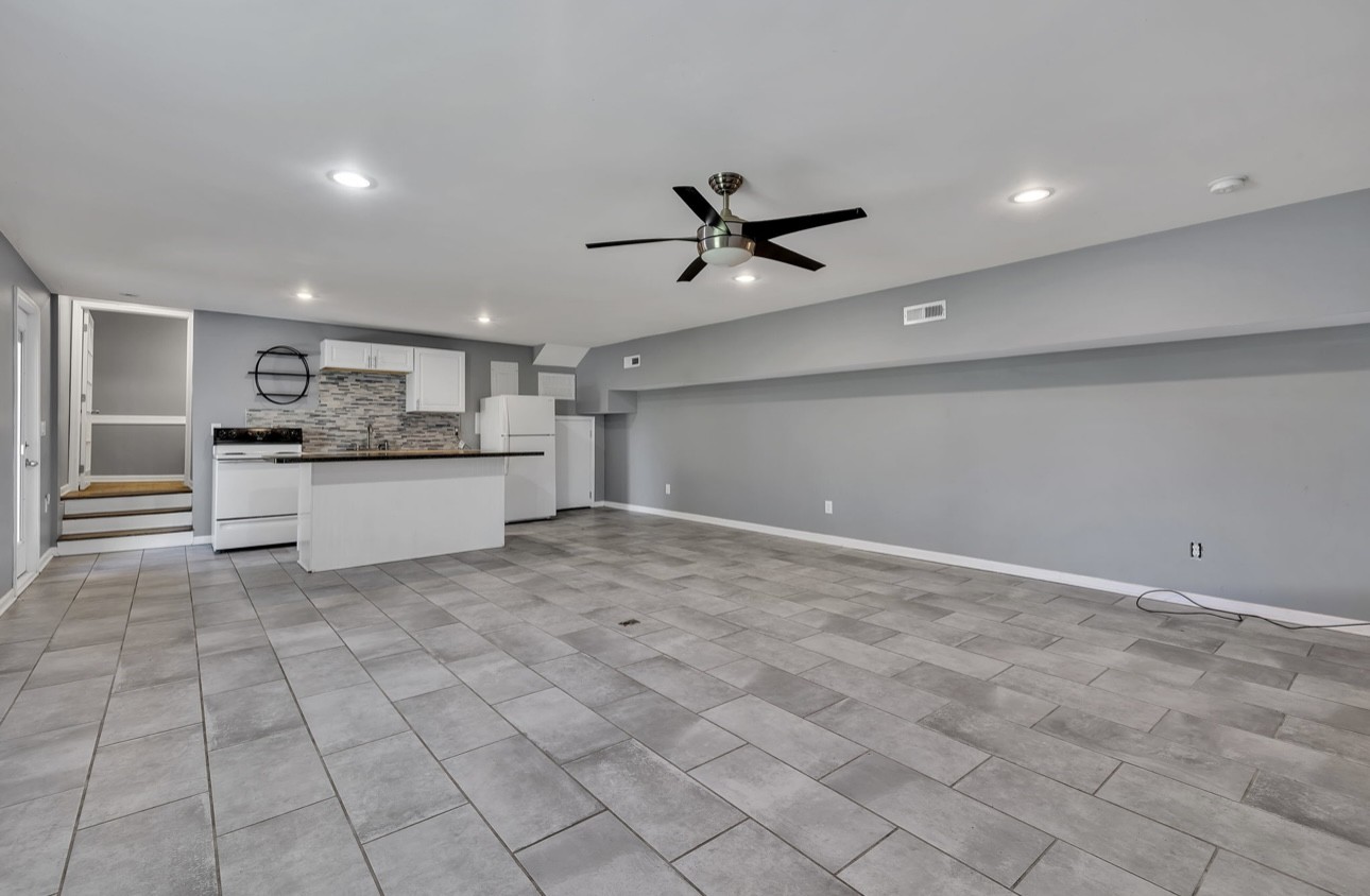 1104 Deer Ridge Road Kingston Springs, TN 37082 - Photo 15 of 36 a view of a kitchen with a sink and a refrigerator