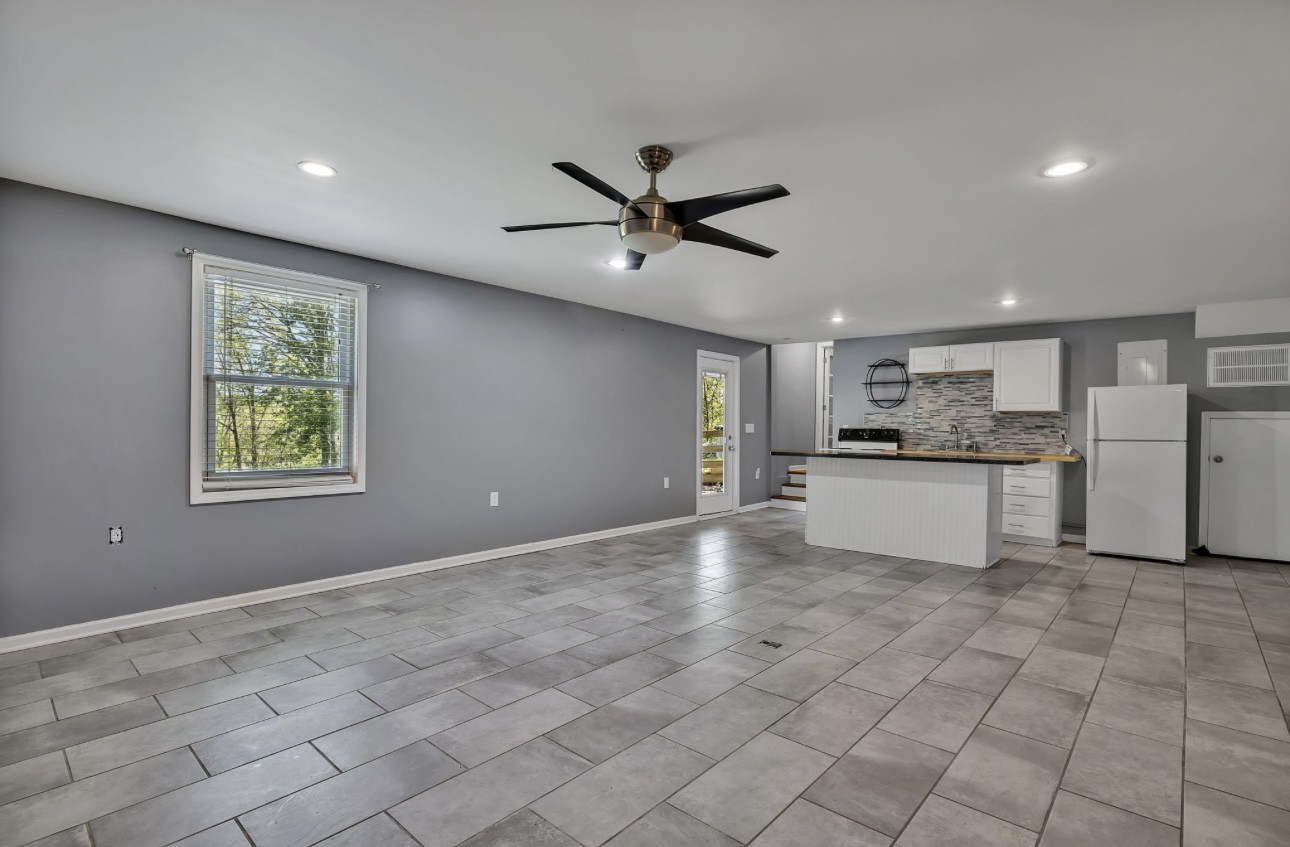 1104 Deer Ridge Road Kingston Springs, TN 37082 - Photo 16 of 36 a view of a kitchen with a sink and cabinets