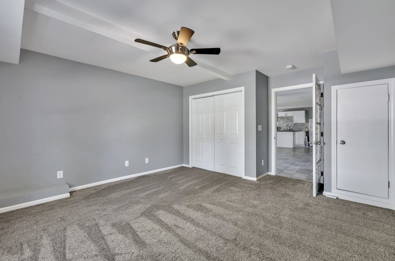 1104 Deer Ridge Road Kingston Springs, TN 37082 - Photo 20 of 36 a view of empty room with wooden floor and ceiling fan