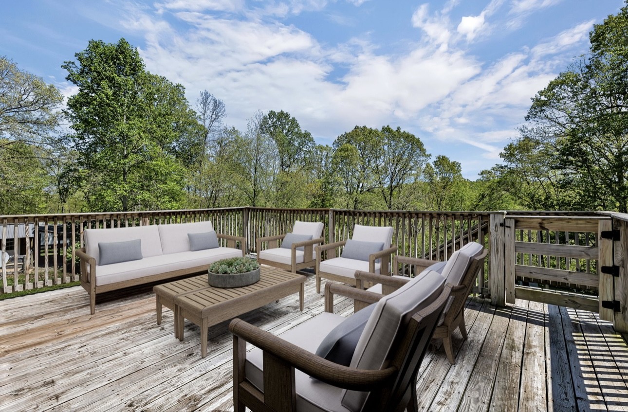 1104 Deer Ridge Road Kingston Springs, TN 37082 - Photo 22 of 36 a view of a balcony with two chairs and wooden floor
