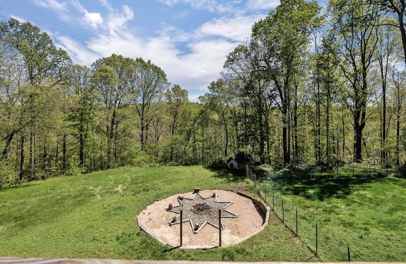 1104 Deer Ridge Road Kingston Springs, TN 37082 - Photo 23 of 36 a view of a swimming pool with a yard