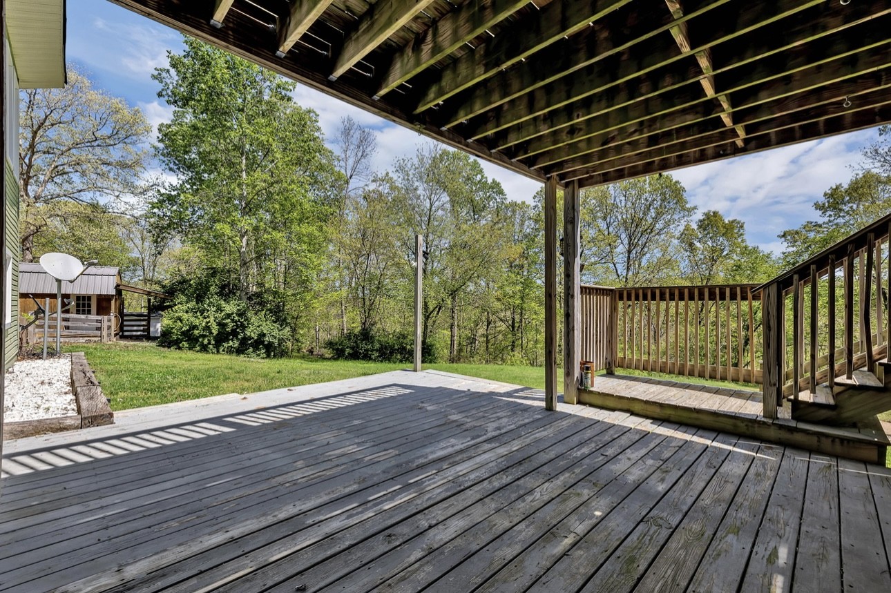 1104 Deer Ridge Road Kingston Springs, TN 37082 - Photo 25 of 36 a view of a backyard with wooden floor