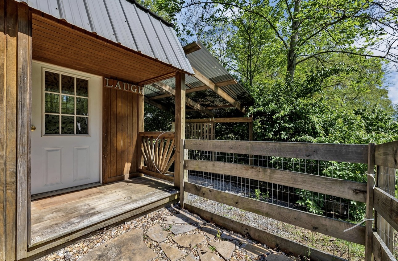 1104 Deer Ridge Road Kingston Springs, TN 37082 - Photo 26 of 36 a view of backyard with deck and wooden floor