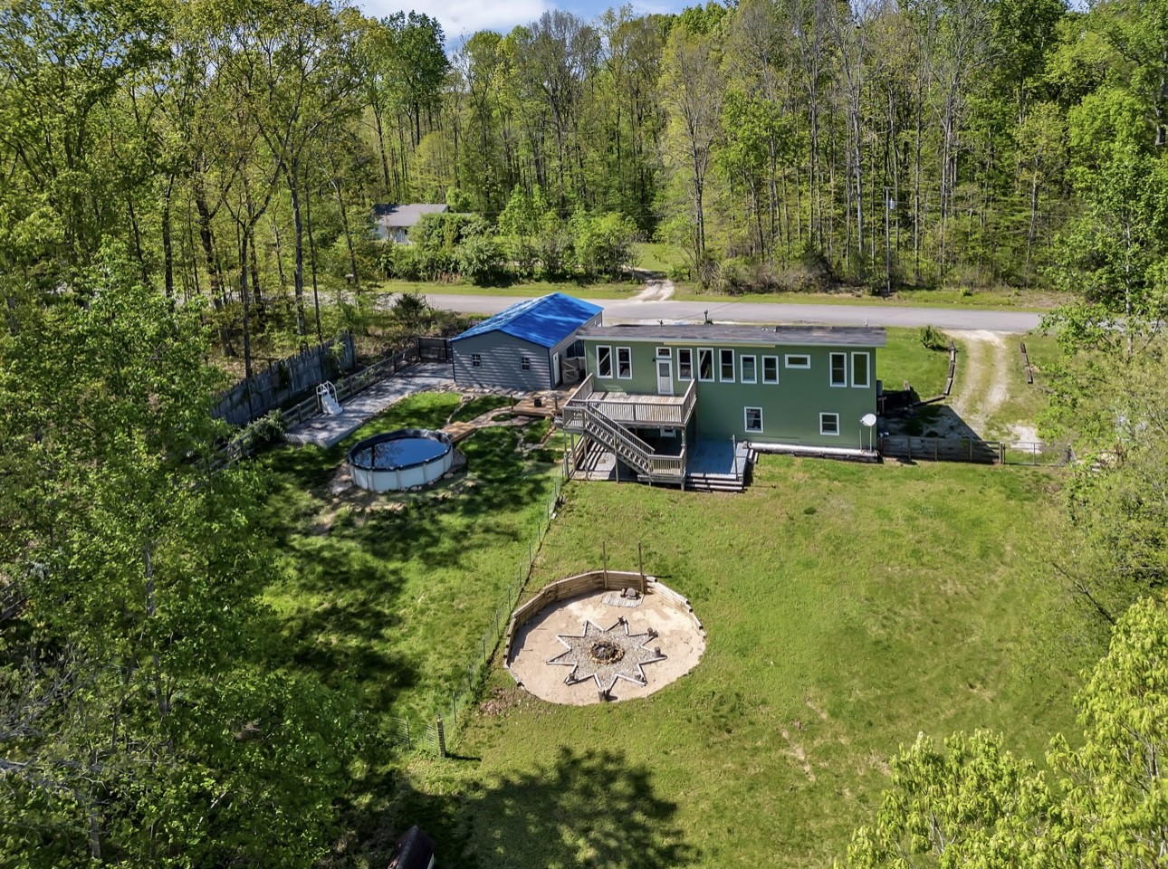 1104 Deer Ridge Road Kingston Springs, TN 37082 - Photo 30 of 36 an aerial view of a house with swimming pool garden and patio