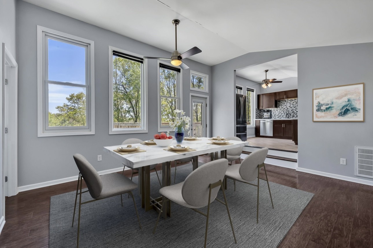 1104 Deer Ridge Road Kingston Springs, TN 37082 - Photo 4 of 36 a view of a dining room with furniture a chandelier and wooden floor