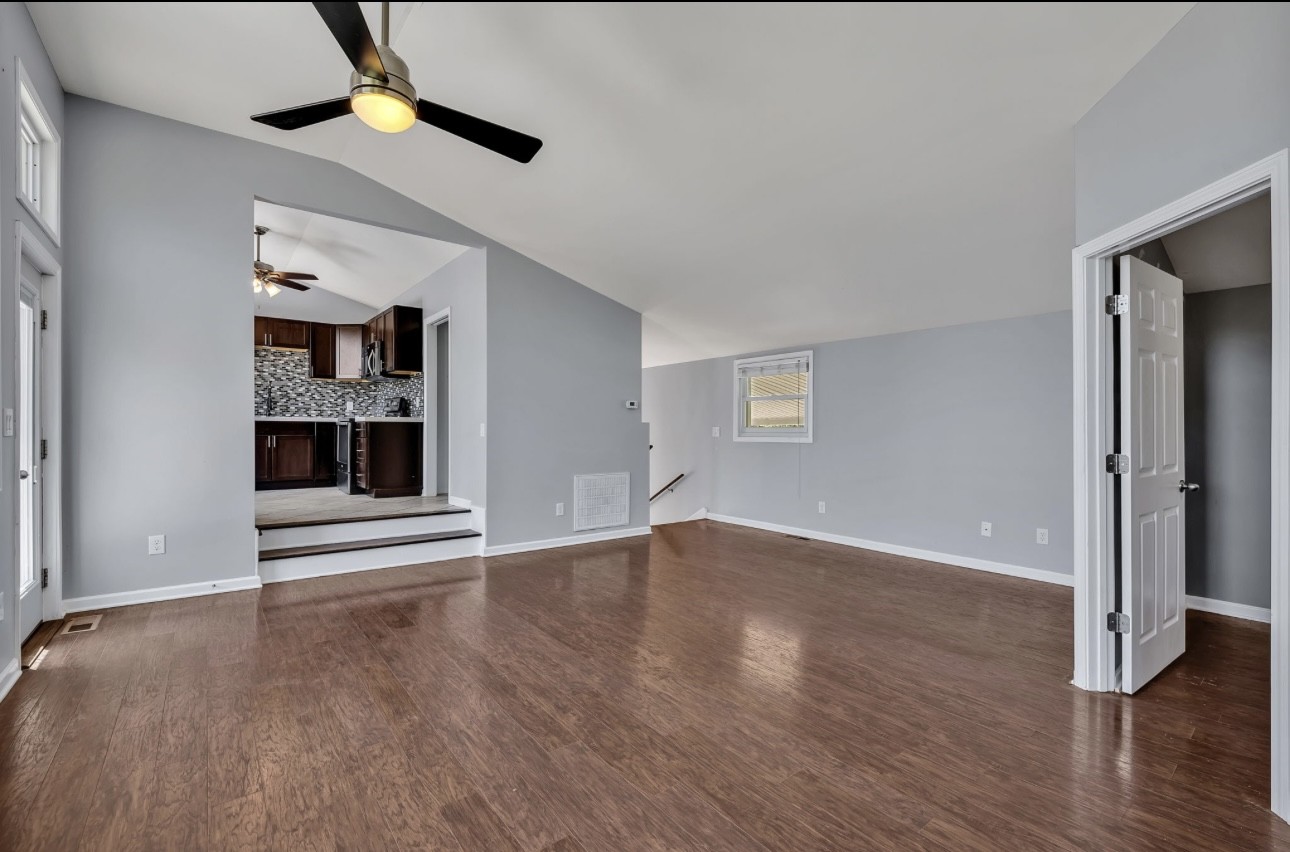 1104 Deer Ridge Road Kingston Springs, TN 37082 - Photo 6 of 36 wooden floor in an empty room with a window