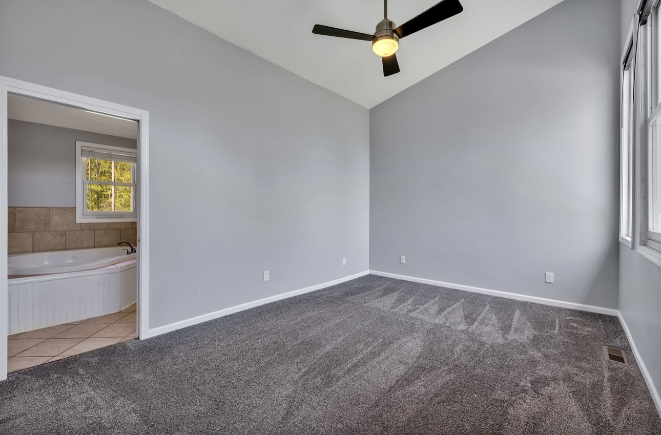 1104 Deer Ridge Road Kingston Springs, TN 37082 - Photo 9 of 36 a view of an empty room and window