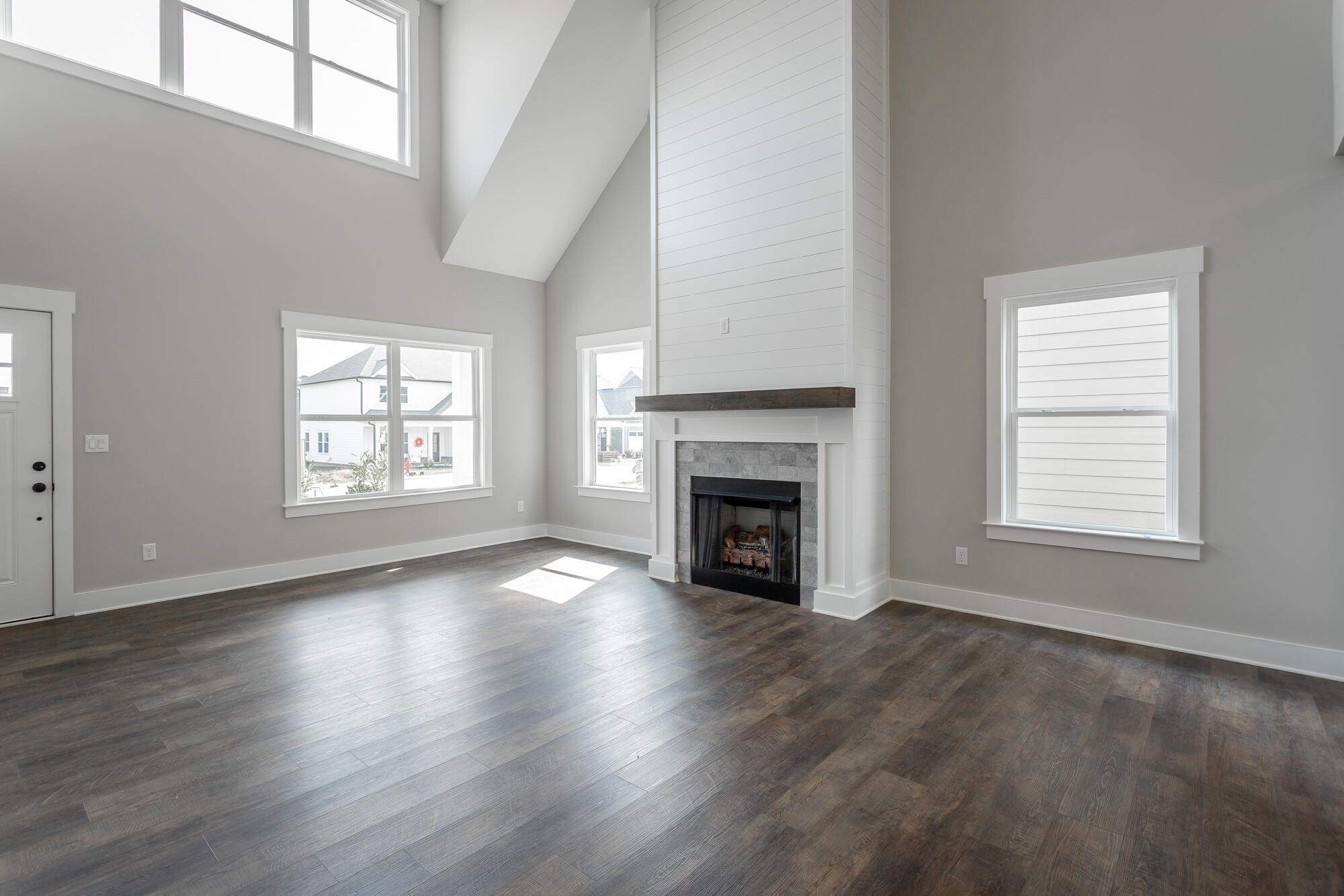 364 Willow Grv Court, Unit 67 Ringgold, GA 30736 - Photo 19 of 78 an empty room with wooden floor windows and fireplace