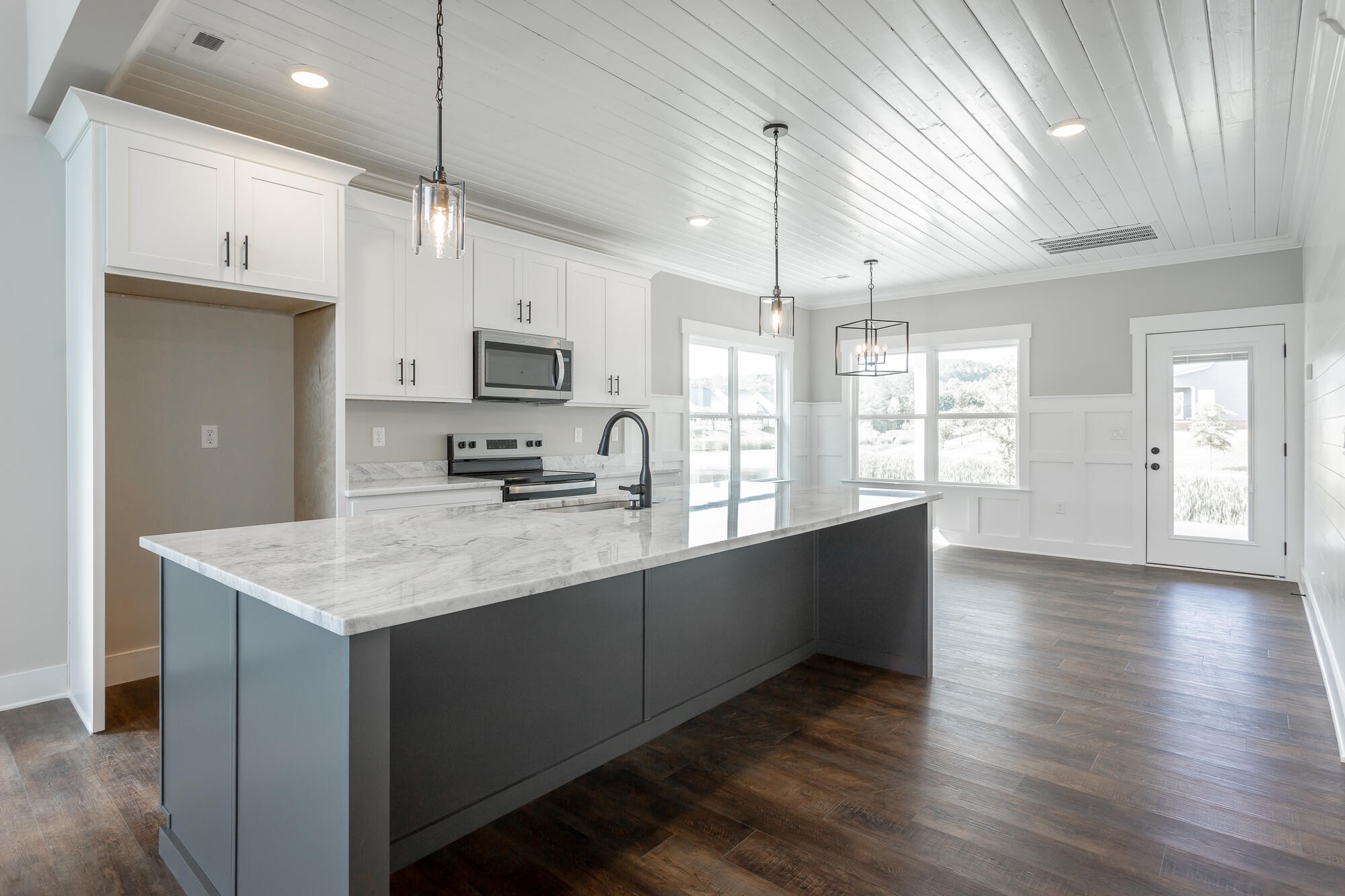 364 Willow Grv Court, Unit 67 Ringgold, GA 30736 - Photo 23 of 78 a kitchen with stainless steel appliances granite countertop a sink a stove and a wooden floors