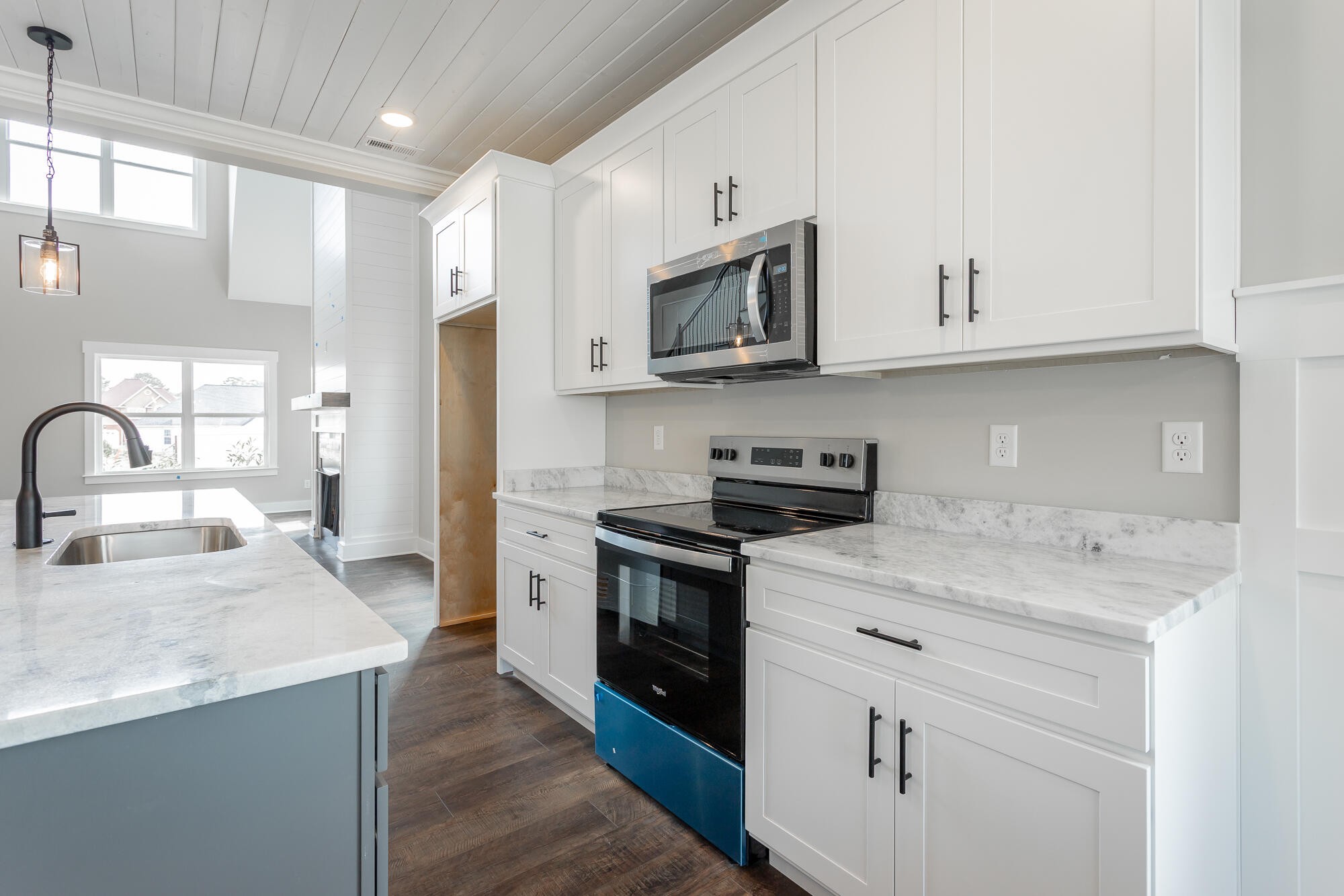 364 Willow Grv Court, Unit 67 Ringgold, GA 30736 - Photo 28 of 78 a kitchen with stainless steel appliances granite countertop a sink dishwasher a stove and a microwave oven with white cabinets
