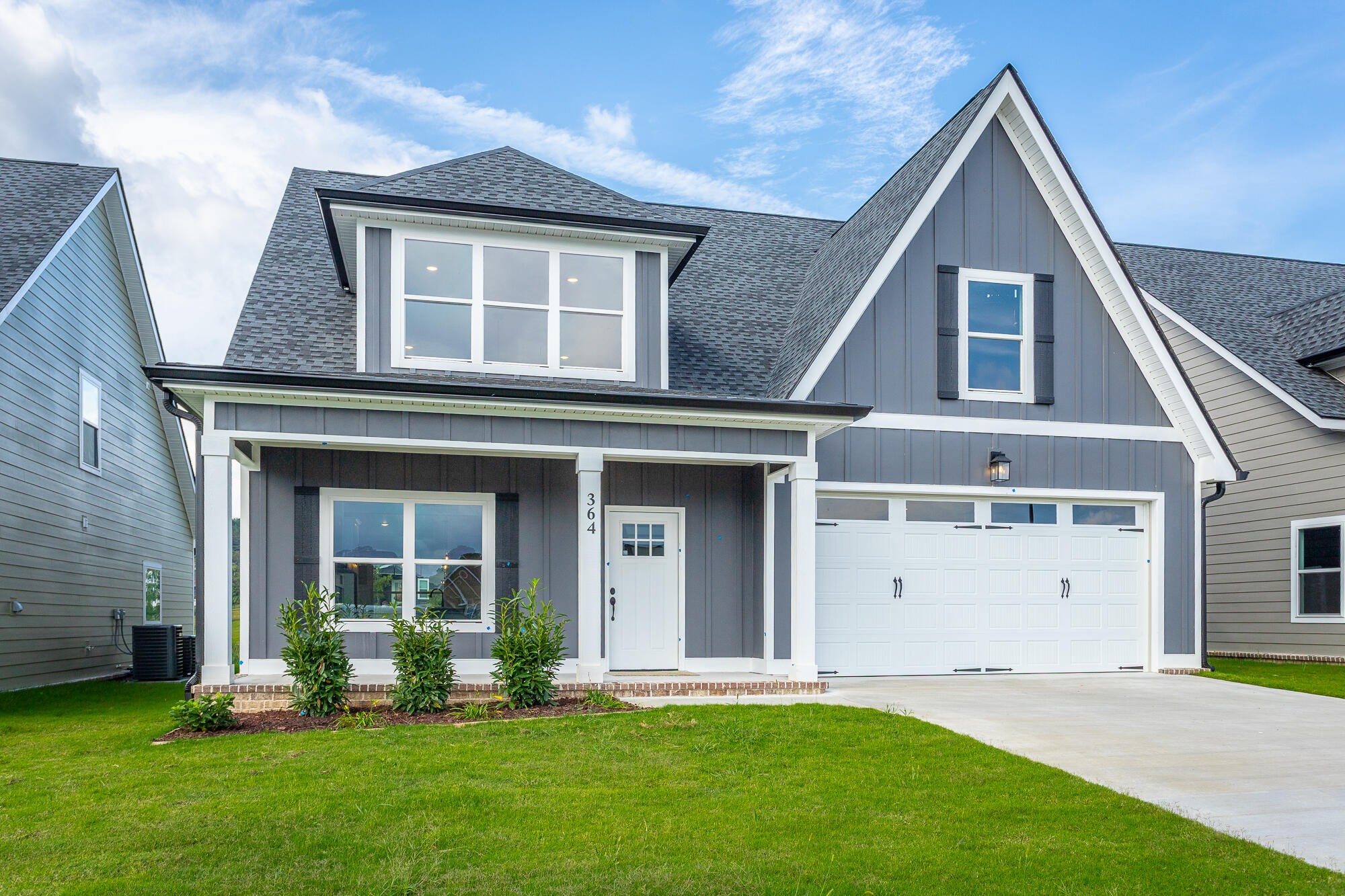 364 Willow Grv Court, Unit 67 Ringgold, GA 30736 - Photo 3 of 78 a front view of a house with a yard and garage