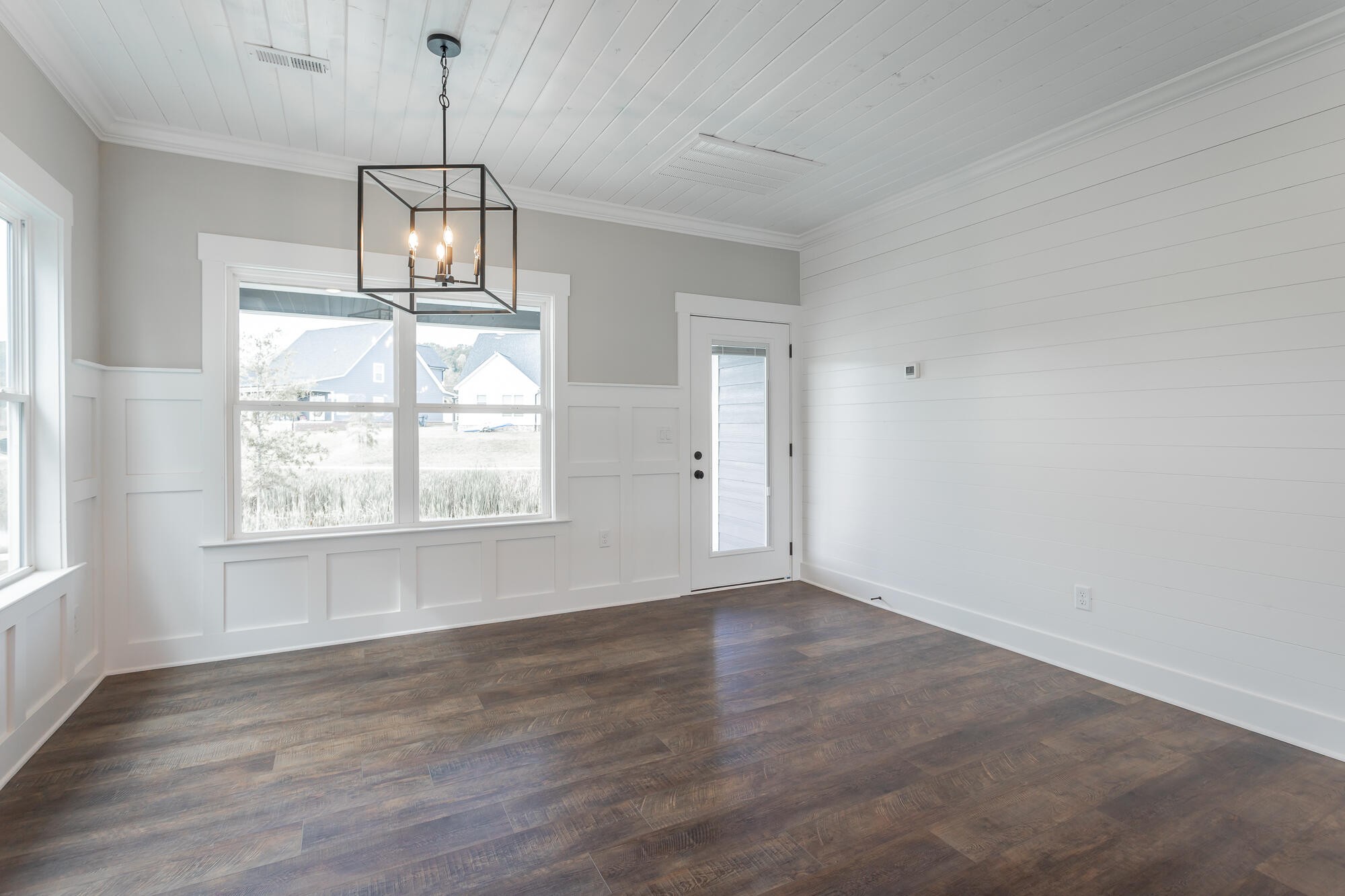 364 Willow Grv Court, Unit 67 Ringgold, GA 30736 - Photo 35 of 78 an empty room with wooden floor exposed radiator and windows