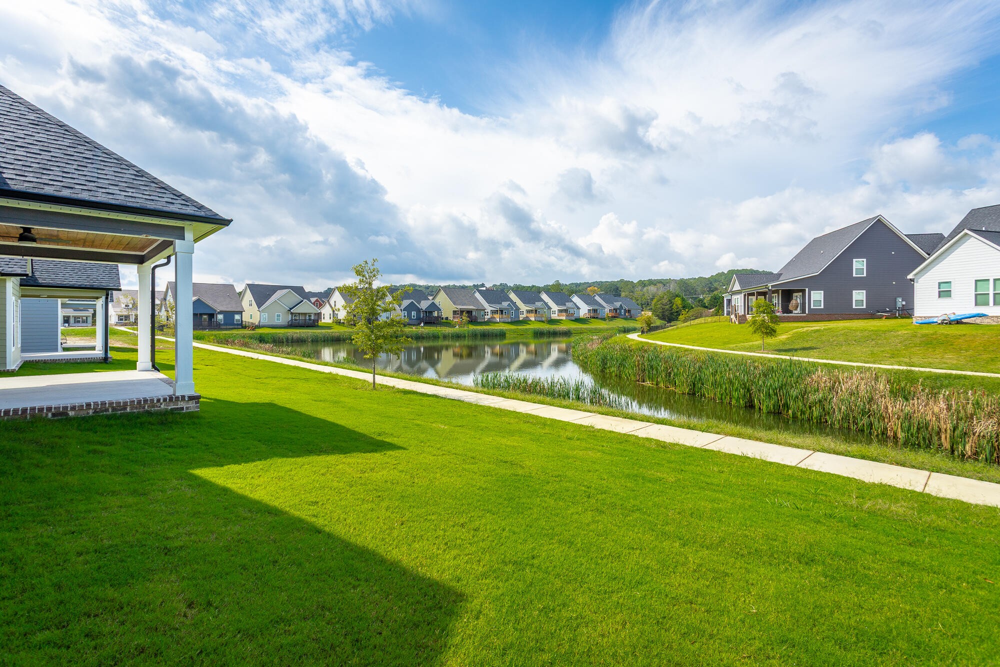 364 Willow Grv Court, Unit 67 Ringgold, GA 30736 - Photo 4 of 78 a view of a house with a big yard and a large tree