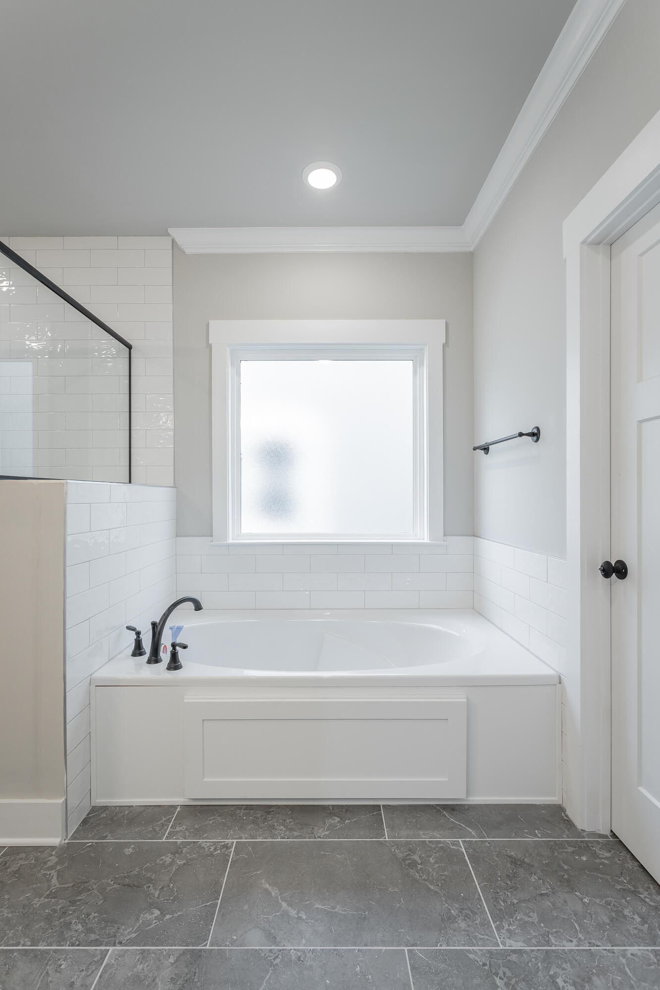 364 Willow Grv Court, Unit 67 Ringgold, GA 30736 - Photo 44 of 78 a bathroom with a bathtub and a window