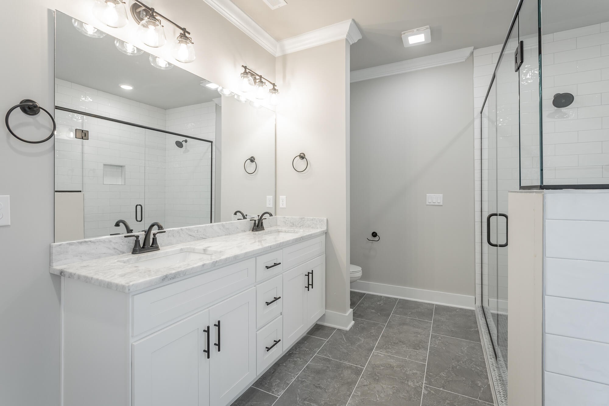 364 Willow Grv Court, Unit 67 Ringgold, GA 30736 - Photo 46 of 78 a bathroom with a double vanity sink mirror double and shower