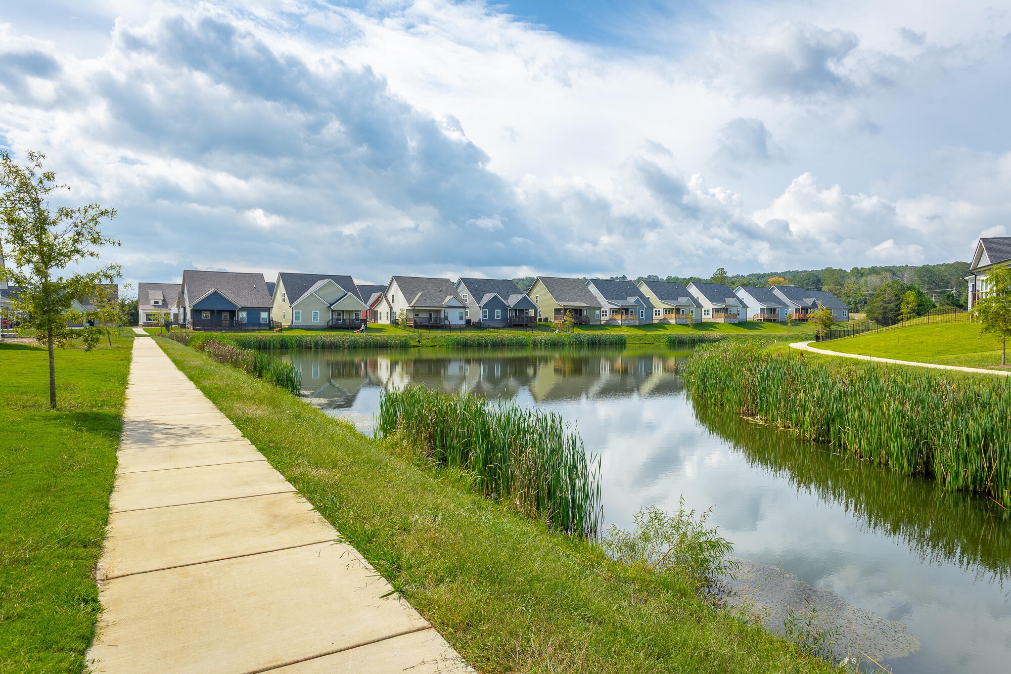 364 Willow Grv Court, Unit 67 Ringgold, GA 30736 - Photo 6 of 78 a view of a lake with houses in the back