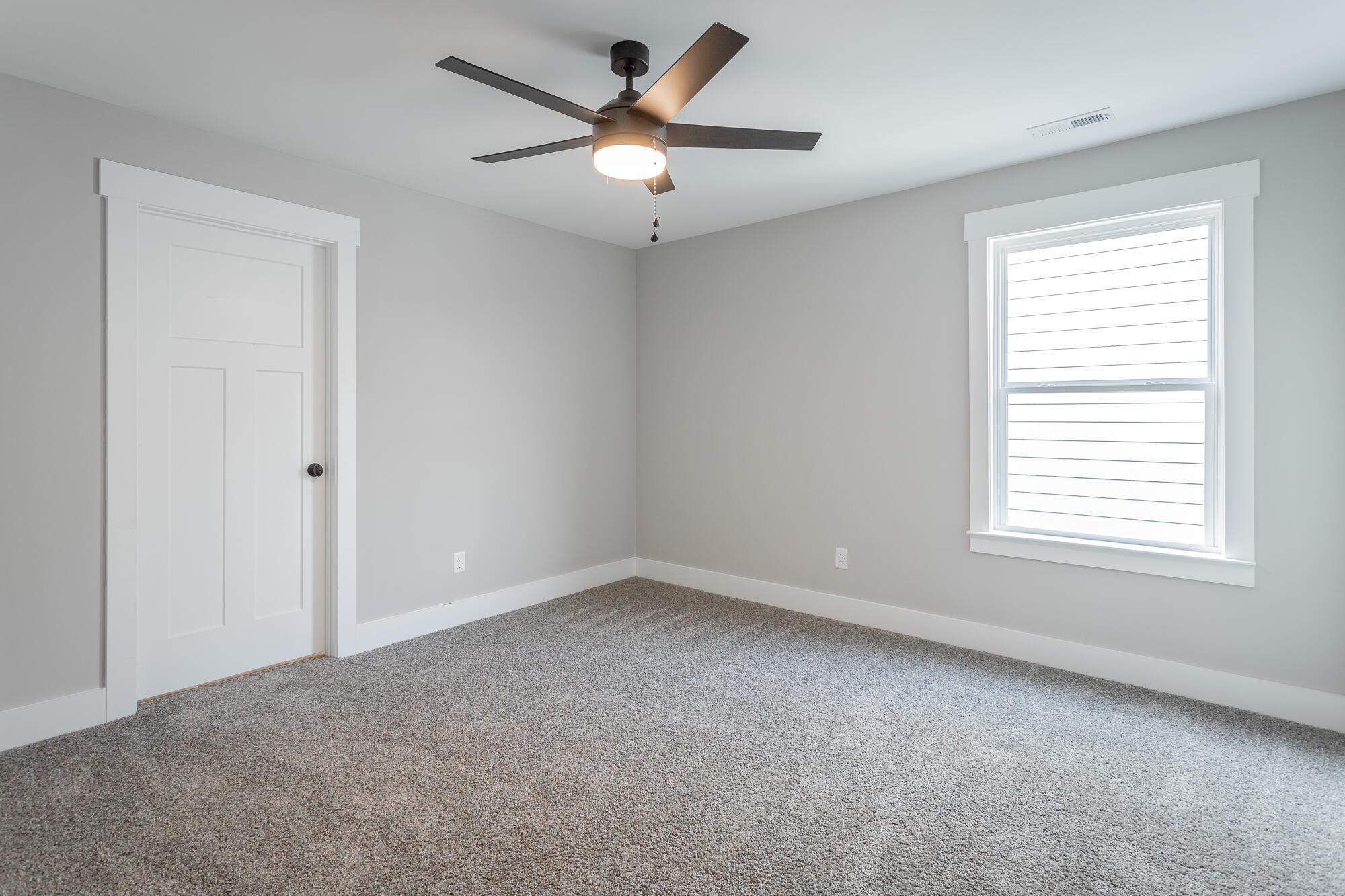 364 Willow Grv Court, Unit 67 Ringgold, GA 30736 - Photo 63 of 78 an empty room with a window and a fan