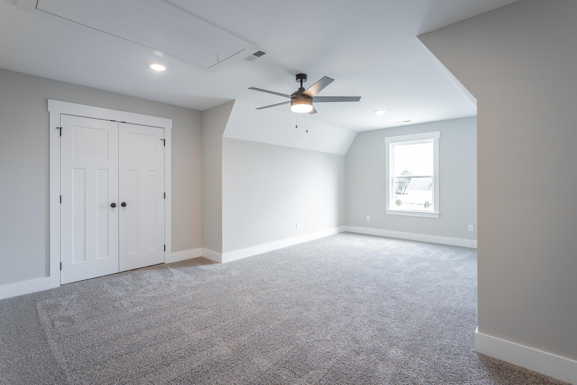 364 Willow Grv Court, Unit 67 Ringgold, GA 30736 - Photo 67 of 78 an empty room with a window and a ceiling fan
