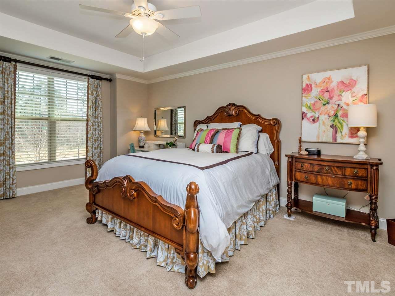 1589 Fullerton Place Raleigh, NC 27607 - Photo 14 of 25 a bedroom with a bed and a chandelier