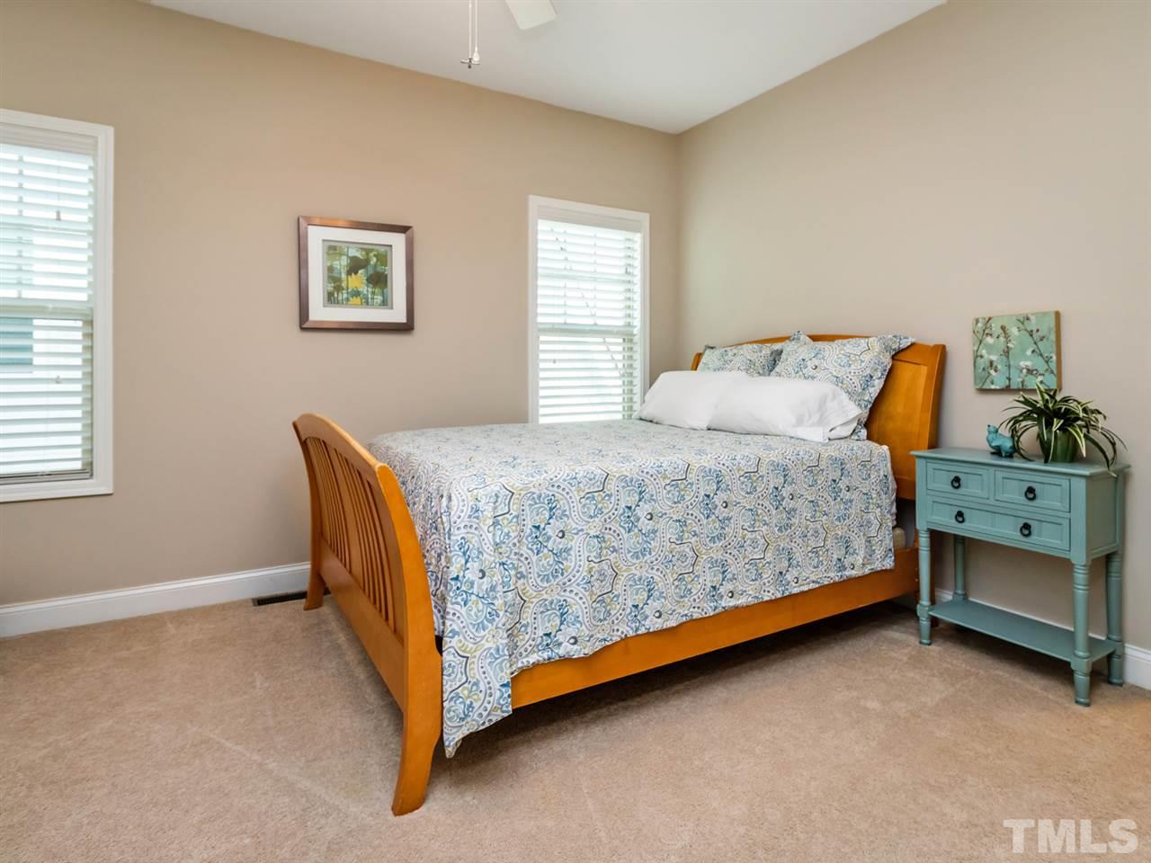 1589 Fullerton Place Raleigh, NC 27607 - Photo 18 of 25 a bedroom with a bed and a window