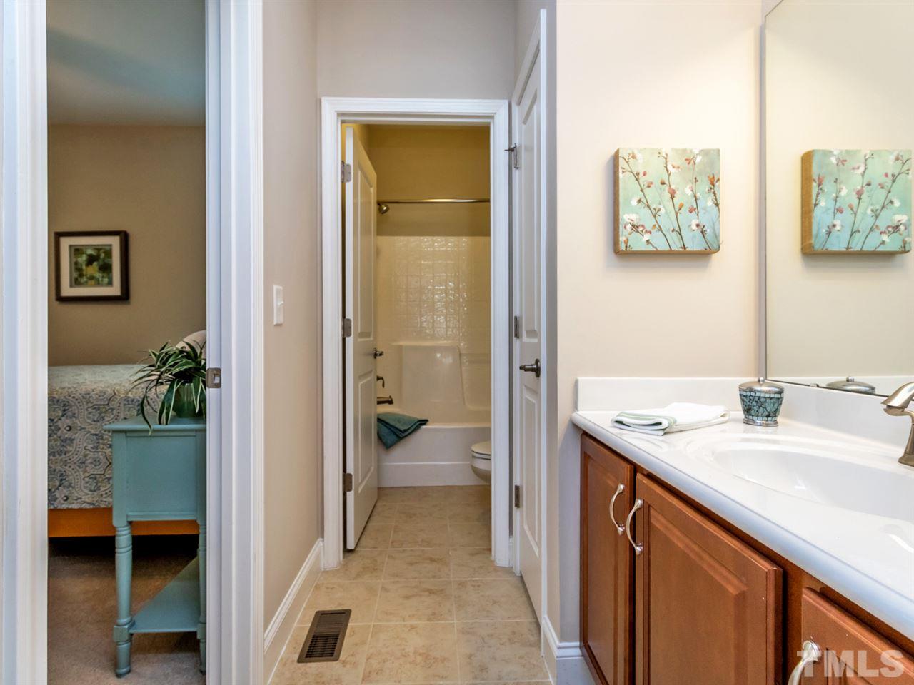 1589 Fullerton Place Raleigh, NC 27607 - Photo 19 of 25 a bathroom with a sink and a mirror