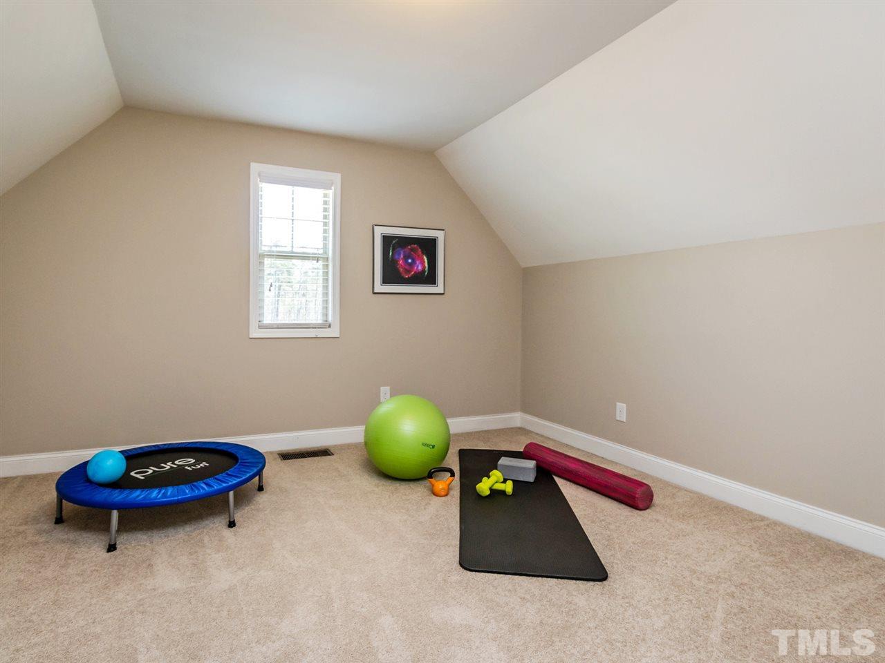 1589 Fullerton Place Raleigh, NC 27607 - Photo 22 of 25 a room with furniture and a window