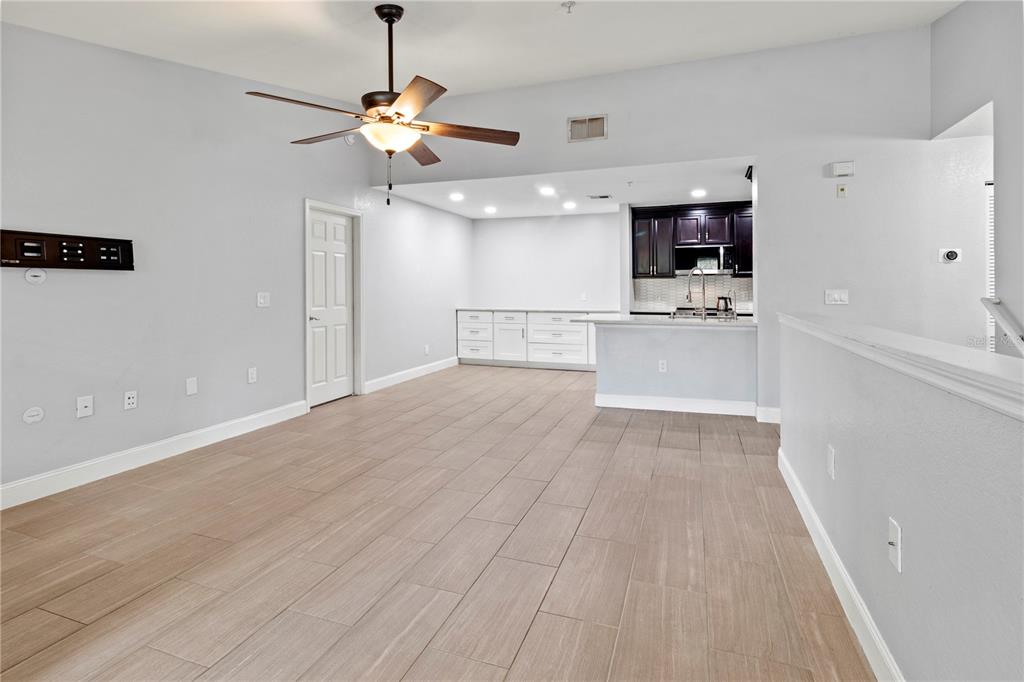 8911 Manor Loop, Unit 204 Lakewood Ranch, FL 34202 - Photo 11 of 45 a view of empty room with wooden floor and fan