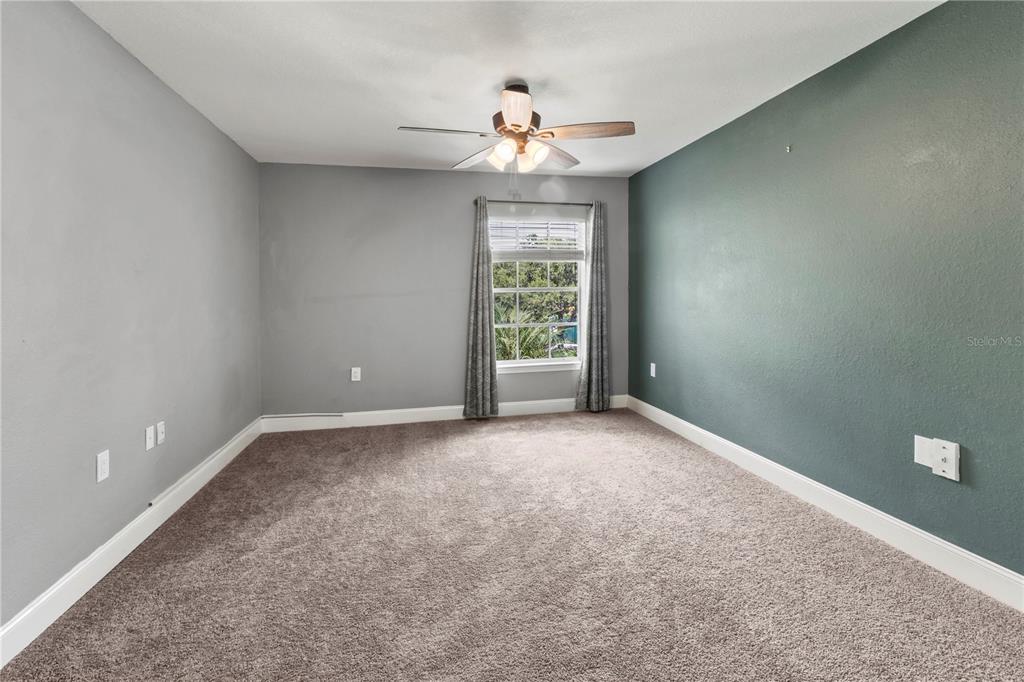 8911 Manor Loop, Unit 204 Lakewood Ranch, FL 34202 - Photo 16 of 45 a view of an empty room with a window